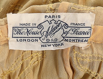Lot 85 - An Adair beaded yellow silk flapper dress,...