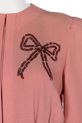 Lot 86 - A pink crêpe ensemble embellished with...
