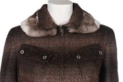 Lot 42 - A Chanel purple tweed suit, Autumn 2003,...