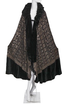 Lot 411 - An opera cape formed from an Azute/Assuit shawl, 1920s