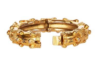 Lot 21 - A Chanel gold tone bangle, late 1970s