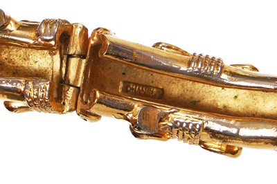 Lot 21 - A Chanel gold tone bangle, late 1970s