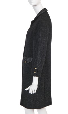 Lot 22 - A Chanel haute couture black bouclé wool coat, late 1960s-early 70s