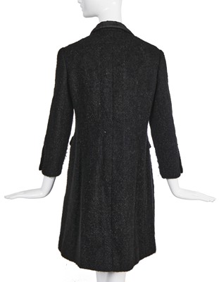 Lot 22 - A Chanel haute couture black bouclé wool coat, late 1960s-early 70s