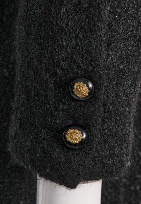 Lot 22 - A Chanel haute couture black bouclé wool coat, late 1960s-early 70s