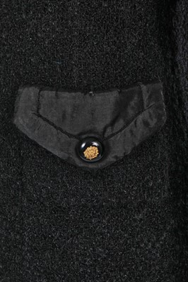 Lot 22 - A Chanel haute couture black bouclé wool coat, late 1960s-early 70s