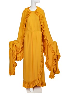 Lot 251 - A Christian Dior haute couture by Marc Bohan sunflower-yellow silk crêpe evening gown, Spring-Summer, 1980
