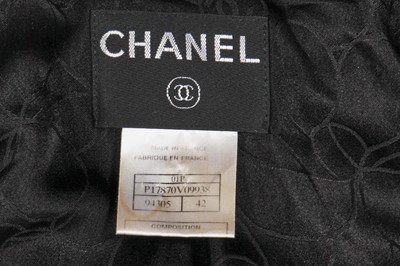 Lot 24 - A Chanel black wool suit, Spring-Summer 2001