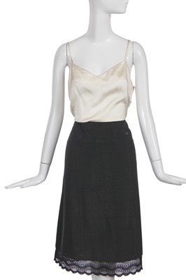 Lot 24 - A Chanel black wool suit, Spring-Summer 2001