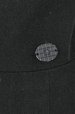 Lot 24 - A Chanel black wool suit, Spring-Summer 2001