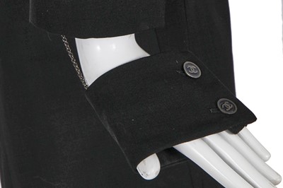 Lot 24 - A Chanel black wool suit, Spring-Summer 2001