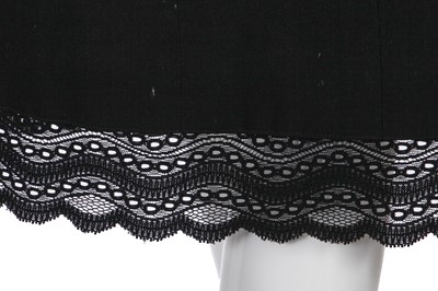 Lot 24 - A Chanel black wool suit, Spring-Summer 2001