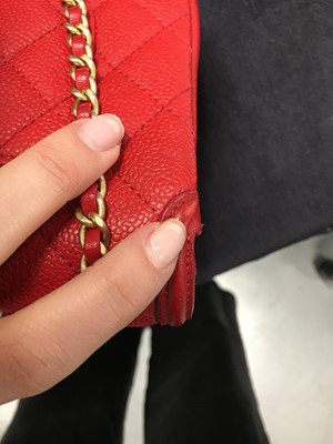 Lot 43 - A Chanel red caviar leather quilted small CC filigree flap bag, 2016-2017