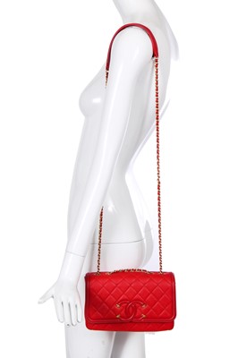 Lot 43 - A Chanel red caviar leather quilted small CC filigree flap bag, 2016-2017