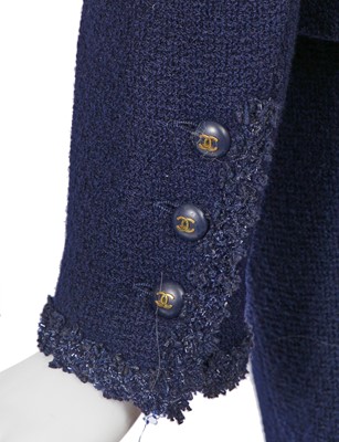 Lot 47 - A Chanel navy blue wool bouclé suit, Cruise 1995