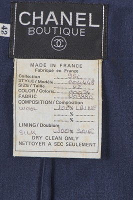 Lot 47 - A Chanel navy blue wool bouclé suit, Cruise 1995