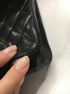 Lot 48 - A Chanel quilted black lambskin leather classic double flap bag, 2010-2011