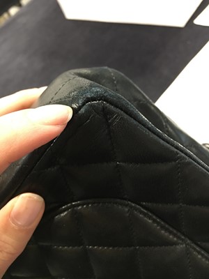 Lot 48 - A Chanel quilted black lambskin leather classic double flap bag, 2010-2011