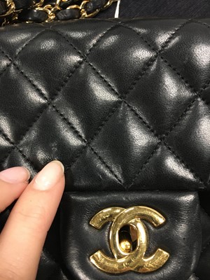 Lot 48 - A Chanel quilted black lambskin leather classic double flap bag, 2010-2011