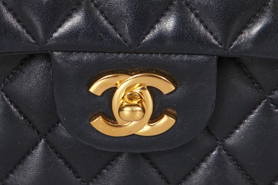 Lot 48 - A Chanel quilted black lambskin leather classic double flap bag, 2010-2011