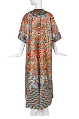 Lot 426 - A woman's finely embroidered apricot-yellow dragon robe, jifu, Chinese, early 19th century