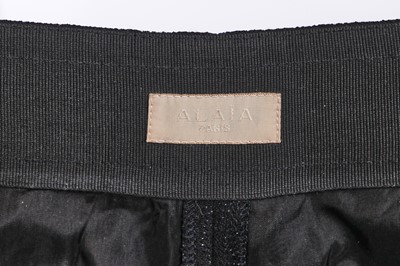Lot 137 - An Azzedine Alaïa black polyester coat, 1990s