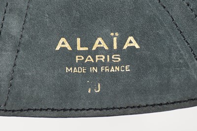 Lot 137 - An Azzedine Alaïa black polyester coat, 1990s