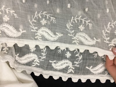 Lot 36 - A rare embroidered white spotted muslin tablier dress, French, circa 1802