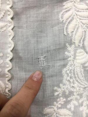 Lot 36 - A rare embroidered white spotted muslin tablier dress, French, circa 1802