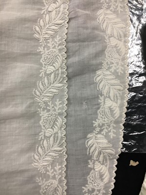 Lot 36 - A rare embroidered white spotted muslin tablier dress, French, circa 1802