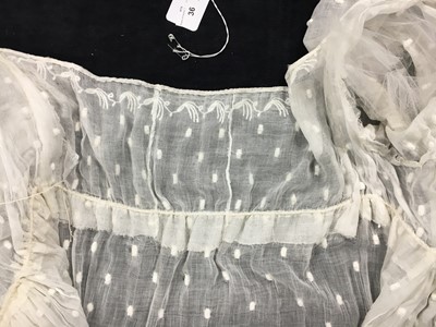 Lot 36 - A rare embroidered white spotted muslin tablier dress, French, circa 1802
