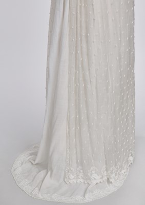 Lot 36 - A rare embroidered white spotted muslin tablier dress, French, circa 1802