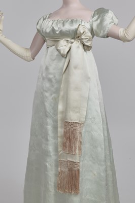 Lot 62 - An eau de Nil satin evening dress, probably French, 1807-1809