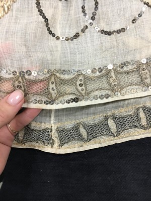 Lot 10 - A fine embroidered and spangled white linen evening gown, French, circa 1796