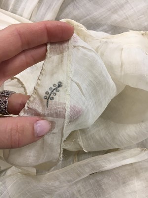 Lot 10 - A fine embroidered and spangled white linen evening gown, French, circa 1796