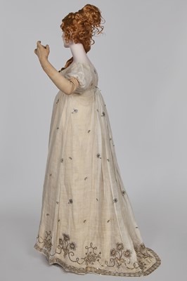 Lot 10 - A fine embroidered and spangled white linen evening gown, French, circa 1796