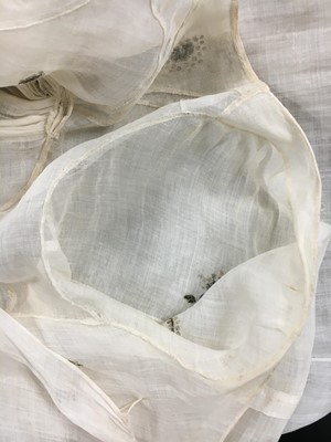 Lot 10 - A fine embroidered and spangled white linen evening gown, French, circa 1796