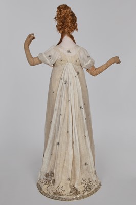 Lot 10 - A fine embroidered and spangled white linen evening gown, French, circa 1796