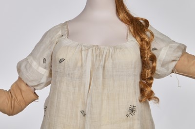 Lot 10 - A fine embroidered and spangled white linen evening gown, French, circa 1796