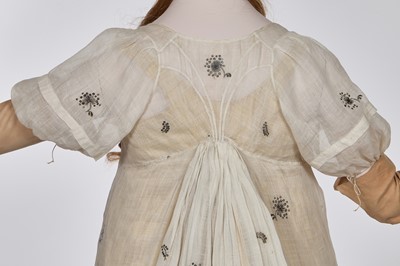 Lot 10 - A fine embroidered and spangled white linen evening gown, French, circa 1796