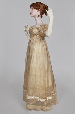 Lot 60 - A striped gold silk gauze ball gown, English, circa 1810