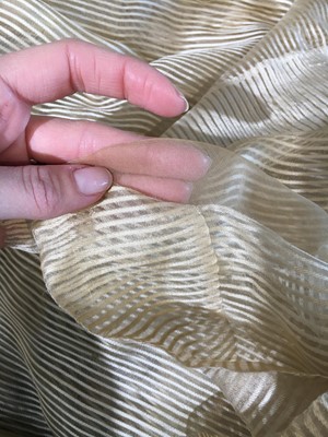 Lot 60 - A striped gold silk gauze ball gown, English, circa 1810