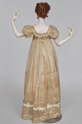 Lot 60 - A striped gold silk gauze ball gown, English, circa 1810
