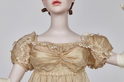 Lot 60 - A striped gold silk gauze ball gown, English, circa 1810