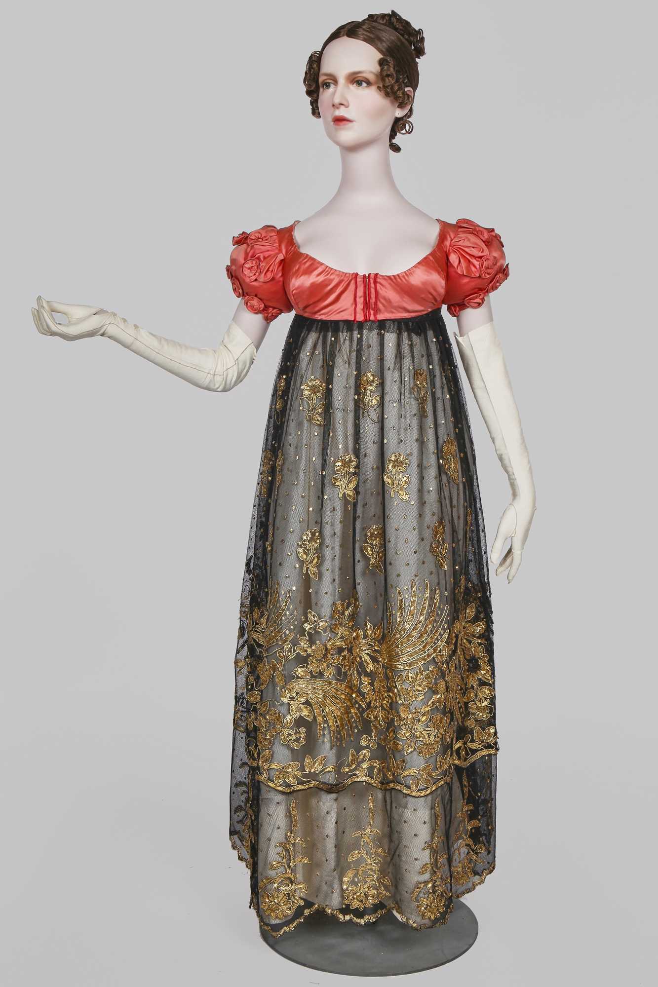 Lot 102 - A pink satin evening bodice with elaborate puff sleeves, English, circa 1815