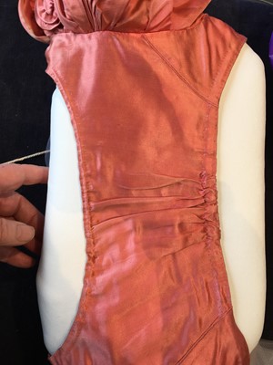 Lot 102 - A pink satin evening bodice with elaborate puff sleeves, English, circa 1815