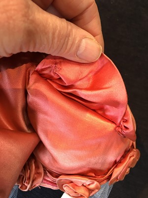 Lot 102 - A pink satin evening bodice with elaborate puff sleeves, English, circa 1815