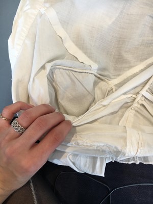 Lot 101 - A white percale morning coat, English, circa 1814
