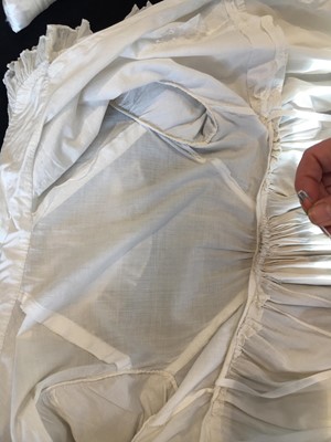 Lot 101 - A white percale morning coat, English, circa 1814
