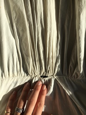 Lot 101 - A white percale morning coat, English, circa 1814